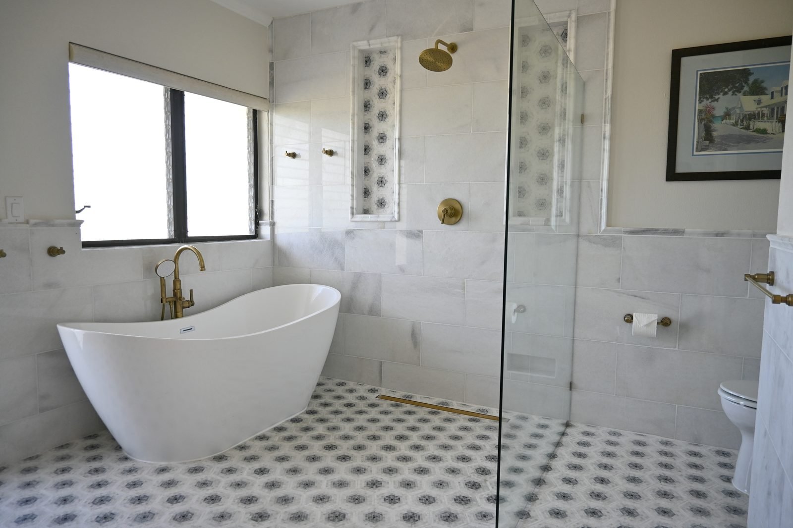 Bird of Paradise ensuite — freestanding soaking tub with checkered marble floor