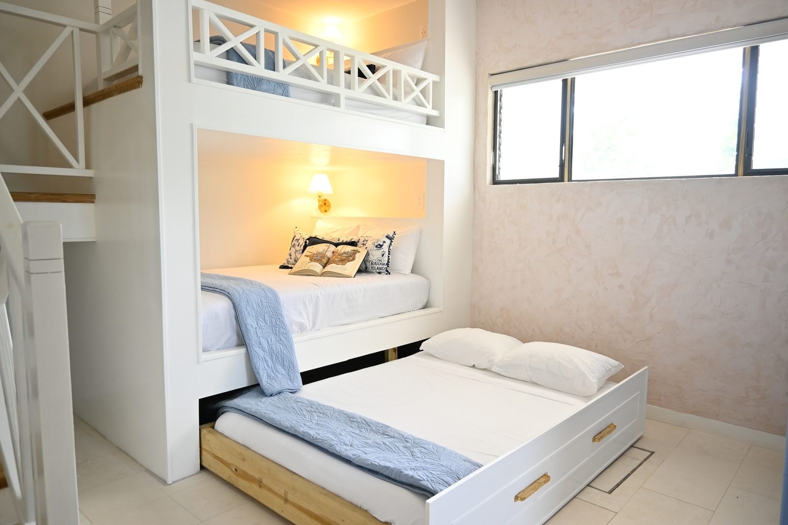Trundle bed pulled out and made up — six full beds total