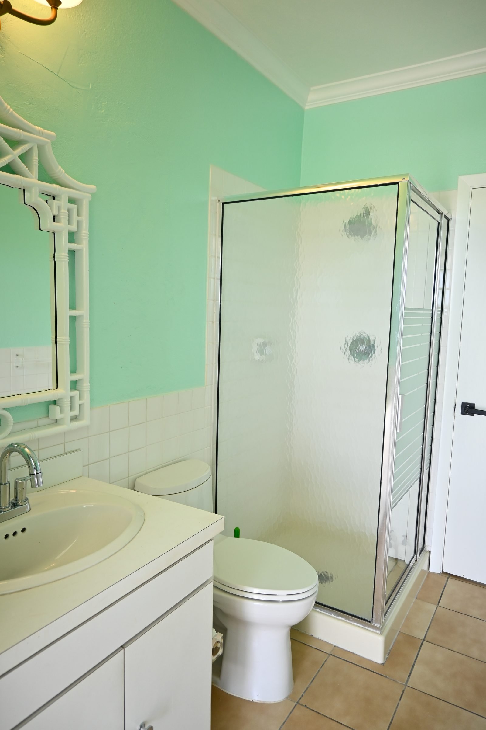 Guest bathroom — glass shower with mint green walls